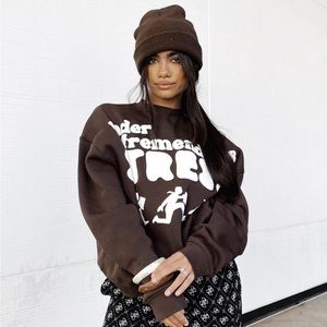 Sisters and Seekers “under tremendous stress” crewneck sweater